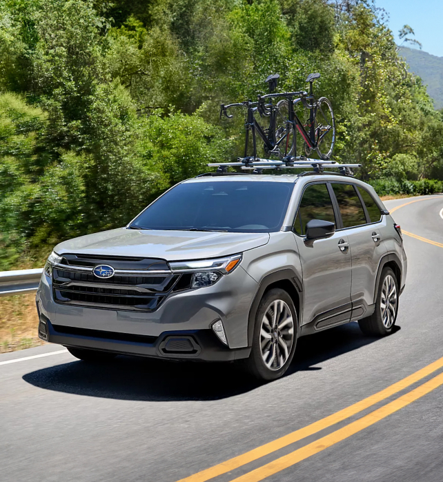 Subaru SUV driving on Road